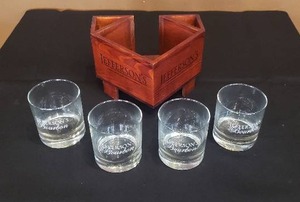 lot 125 image: Jeffersons Bourbon 4 Glass Set and Napkin Holder