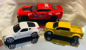 lot 285 image: Maisto Ford Mighty F-350, Maisto 2007 Nissan 370Z and 2017 Camaro Zl1 Scale 138 by Kinsmart