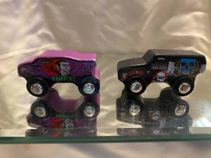 lot 291 image: JAdore Paris Wood Toy Mini Monster Trucks, Black with Skulls and Purple Vampire