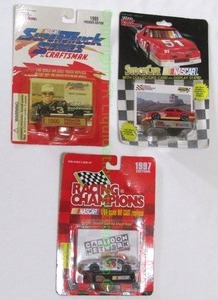lot 34 image: Racing Champions NASCAR die cast minis with driver cards in unopened blister packs