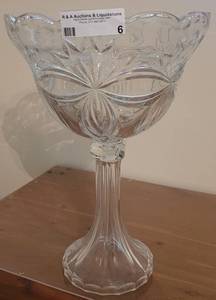 lot 6 image: TALL FOOTED HEAVY GLASS VASE.