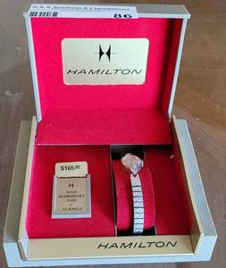 lot 86 image: VINTAGE 1975 HAMILTON 10K GOLD LADIES WRIST WATCH 896971 WITH ORIGINAL BOX AND PURCHASE RECEIPT. SEARCH IT UP