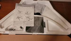 lot 214 image: TOSHIBA TV STAND IN PACKAGE.