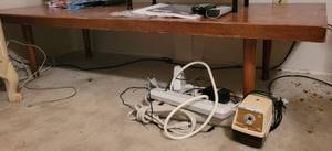 lot 270 image: LOW HEIGHT WOODEN TABLE, POWER SURGES, ELECTRIC PENCIL SHARPENER.