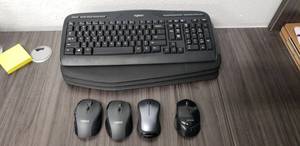 lot 24 image: Lot of 4 Wireless Keyboards (3 Logitech MK710 and 1 Logitech Y-R009) and 4 Wireless Mice (2 Logitech M705, 1 Logitech M310, and 1 Blackweb BWA18HO017