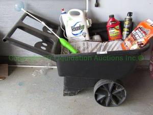 lot 21 image: Rubbermaid wheel barrel and lawn & garden chemicals plus two bags of soil