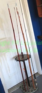 lot 59 image: Bamboo fishing poles plus and pole holder stand