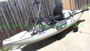 lot 3 image: Lowrance Hobie Cat Mirage Pro Angler 12 fishermans kayak, includes landing gear, Livewell XL live bait tank, Oars, and accessories. Used only twice