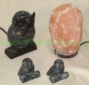 lot 103 image: Himalayan salt lamp, Owl night light and stone carved owls
