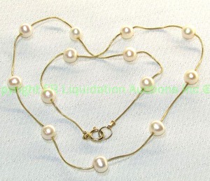 lot 114 image: 14K yellow gold and cultured pearl station rope necklace (Marked 14K CCI)