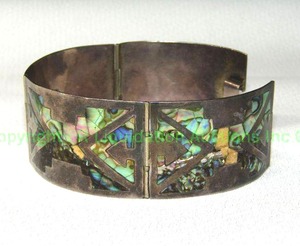 lot 106 image: Vintage Silver Sterling panel bracelet with inlaid mosaic AbalonePaua shell (missing some pieces), made in Mexico Marked 925 w makers mark.