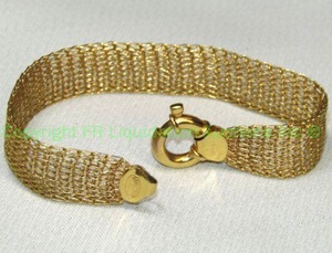 lot 109 image: 14K yellow gold Italian mesh wide bracelet with oversized jump ring clasp. Marked 14K Italy