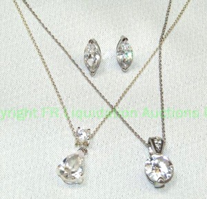 lot 112 image: .925 silver (marked .925) CZ fashion jewelry including two faceted pendant necklaces and earrings