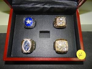 lot 4 image: (4 0F 5) DALLAS COWBOYS SUPERBOWL CHAMPIONSHIP RING COLLECTION (MISSING 3RD) IN NICE WOOD DISPLAY BOX