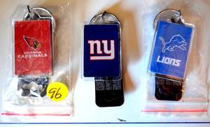lot 96 image: ASSORTMENT OF NFL LICENSED KEYCHAINS - CARDINALS, GIANTS, & LIONS