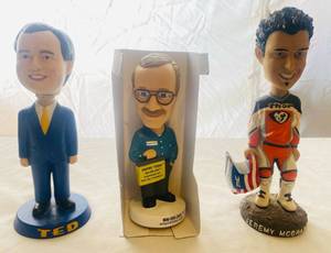 lot 31 image: Jeremy McGrath, Empire Today Guy, and Ted Arneault of Mountaineer Horse Racing Bobbleheads