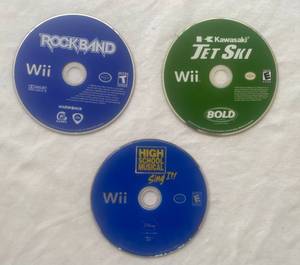 lot 35 image: Wii Games - Guitar Hero - Rock band, Kawasaki Jet Ski, and High School Musical