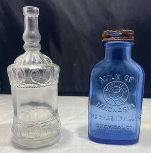 lot 51 image: Vintage Bottles - Milk of Magnesia Chas H. Phillips Chemical Co. 098B and Lefton Bottle