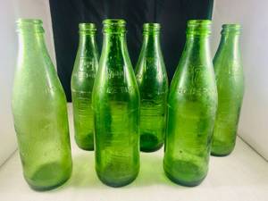 lot 65 image: 5 Vintage 7-UP glass Bottles and 1 Mountain Dew Bottle