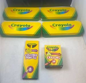 lot 94 image: 4 Crayola Tins filled with Crayons, colored pencils and Markers, a pack of 8 colored pencils