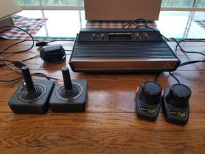 lot 128 image: Vintage Atari Video game console with controllers