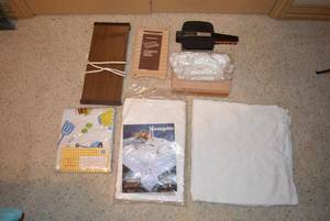 lot 20 image: Kitchen Lot 2 Georgette Lace Tablecloths (Package says Oblong 68x86), Backyard USA Tablecloth, Hot Plate, Dough Presses, Little Mac Fast Cooker, and Microwave Roasting Rack
