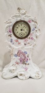lot 82 image: Antique Porcelain case alarm clock by New Haven Clock Co., New Haven, CT.