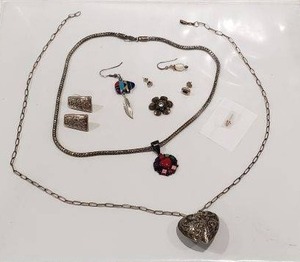 lot 90 image: Sterling Silver multi gemstone pendant with Red Coral, Turquoise, Blue lapis, Black Onyx, Charoite, Pink Agate.