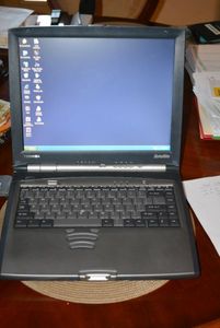 lot 105 image: Toshiba Laptop MK8025GAS Windows XP 128G hard drive with 3 12 floppy and DVD-ROM  see pics