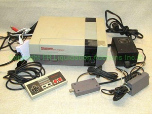lot 8 image: Retro 1985 Nintendo Entertainment System model NES-001 with accessories as shown