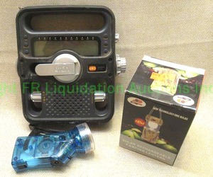 lot 80 image: Eton solar link hand crank radio, Hand crank flashlight, and solar rechargeable lantern
