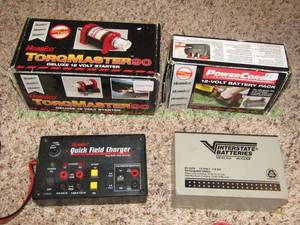 lot 131 image: Hobbico torquemaster 90 RC starter, Quick field charger, 12 volt battery pack, and Interstate batteries 12 volt rechargeable battery