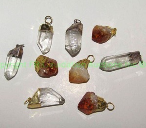 lot 228 image: Quartz and Citrine crystal pendants