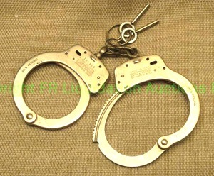 lot 67 image: Genuine Smith & Wesson handcuffs with keys