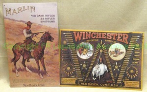 lot 71 image: Winchester & Marlin firearms promotional tin signs
