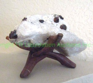 lot 271 image: Garnets in white marble stone in wood display