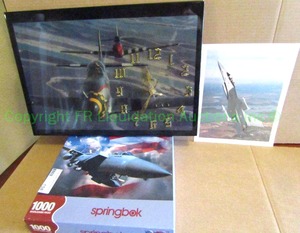 lot 158 image: WW2 aircraft wall clock, F16 falcon pic, and F15 Eagle puzzle