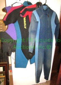 lot 162 image: Sterns, Quicksilver and Hobie wet suits as shown