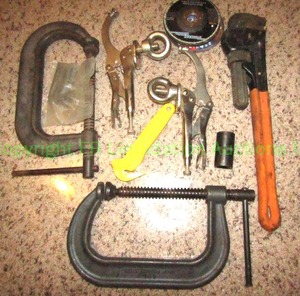 lot 214 image: Large C clamps, pipe wrench and other hand tools as shown