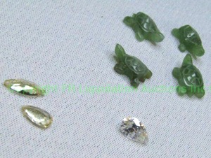 lot 116 image: Jade turtles (approx. 14 each, 4 total), Imperial Topaz 1.42 Ct (2 total), Teardrop crystal
