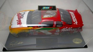 lot 5 image: Signed Terry Labonte &amp Crew Chief Jim Long Nascar 2000 Revell collection die cast Kellogs car #5. In protective display case. (AUTHENTICITY UNKNOWN)