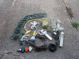 lot 19 image: Variety of extension cords, surge protectors, adapter outlets