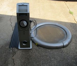lot 34 image: Standing Karaoke machine The Singing Machine w screen, flip up camera, subwoofer, POWERS ON metal brackets, large round piece