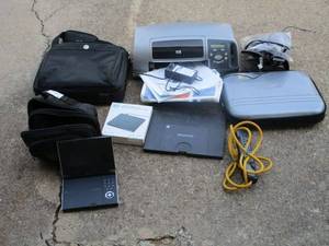 lot 36 image: Toshiba portable dvd player with case and attachable xtra battery - POWERS ON, HP printer - POWERS ON, no box, laptop cases, NCharge power source, compact usb dvd drive