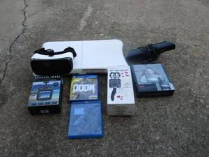 lot 38 image: Vintage Kit Kat clock w rolling eyes, WII balance board, Dash cam, Gear VR Oculus, headphones, Marilyn Monroe portable speaker, 360 Kinect, PS3&amp4 games