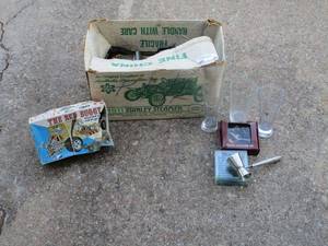lot 43 image: Antique STANLEY STEAMER Decanter, Vintage The Bed Buggy model car, Elvis coasters in box, 6 glass coasters, 3 glasses 2 with long horn emblems