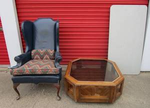 lot 59 image: Vintage octagon glass top coffee table, Blue leather wing back chair, portable table