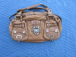 lot 81 image: Brown Juicy Couture purse, lavender inside lining