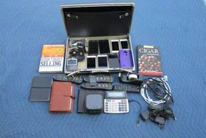 lot 111 image: 8 phones, iphone, blackberry, remotes, organizers, speaker, VINTAGE Samsonite hard case briefcase, miscellaneous chargers