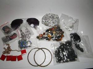 lot 127 image: Costume jewelry, sunglasses, belt buckle, MELE jewelry stand